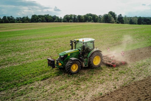 Tractor plowing field