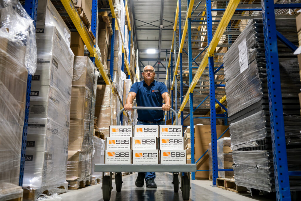 Inventory Technician delivering boxes of fasteners for inventory solutions program