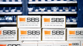 Boxes of fasteners from SBS in front of inventory solutions shelving.